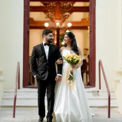 The newly married couple exiting the church, sharing a look of love. This is the beginning of their forever.