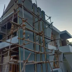 This is the initial stage of a large-scale exterior painting project. The bamboo scaffolding allows my team to safely and effectively access every part of the building's facade for a uniform finish.