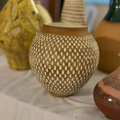 Another one of my favorite pieces, showcasing a detailed, textured pattern that was meticulously carved by hand before glazing.