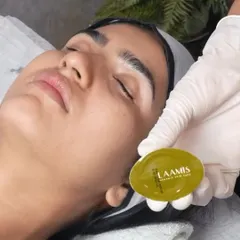 Here, our aesthetician uses a L'AAMIS organic treatment bar during a facial. This step helps to gently massage and infuse the skin with nourishing, plant-based ingredients for a healthy glow.