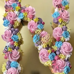 A pull-apart cupcake cake in the shape of the letter 'N'. This is a great alternative to a traditional cake, as guests can just grab a cupcake.