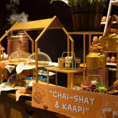 Our "Chai-Shay & Kaapi" corner is a tribute to India's favourite beverages. The station is beautifully designed with golden kettles and rustic elements, creating a warm and inviting space for guests to relax.