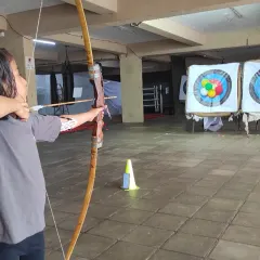 This is what pure focus looks like. I guide every student, young or old, to find their stance, steady their hand, and let the arrow fly. It all starts with learning the correct form.