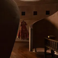 A single garment is displayed like a piece of art within a niche at the House of Masaba. The architecture frames the fashion, with soft, focused light creating moments of drama and focus.