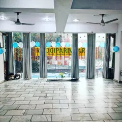 Our studio decorated for our one-year anniversary celebration. It's more than a yoga space; it's a home for our parivaar.