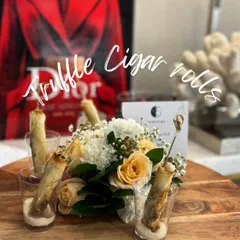 One of my signature creations, the Truffle Cigar Roll. I serve this crisp, flaky roll filled with an indulgent truffle cream in an elegant shot glass for a modern and sophisticated touch.