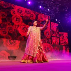 A beautiful solo moment on stage. The right lighting, costume, and expression can make any performance magical.