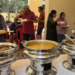 Guests enjoying our food at a daytime Holi party. My buffet service is perfect for any celebration, big or small, ensuring everyone gets to eat hot and tasty food together.