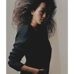 This image from the "Patricia" series uses shadow to create a sense of mystery and drama. The light just catches the side of her face, highlighting her expression and the texture of her hair.