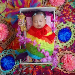 Even the tiniest babies can celebrate Holi! This newborn is wrapped in a rainbow of colours, creating a safe and beautiful way to mark their first festival of colours.