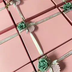 We chose a simple yet elegant pink and mint green color palette for this large order of return favors. Each box is tied with a custom "Love and Happiness" ribbon and a heartfelt message tag, showing our focus on beautiful, meaningful details.