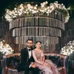 Shikha and her partner at their glamorous cocktail event in Raipur. Her metallic Amit Aggarwal gown was paired with a sophisticated updo and a soft smoky eye.