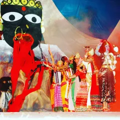We love bringing cultural stories to life on stage. This image captures a powerful moment from an Indian musical theatre production, featuring elaborate costumes and a dramatic, custom-designed stage prop.