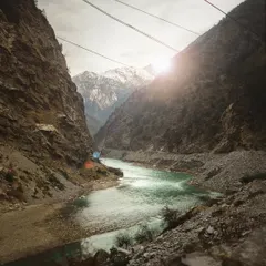 On the road to Kaza in Spiti Valley. The original shot was a bit flat, so I added a sun flare in the edit to bring out the drama of the landscape. This kind of post production work helps me craft the final mood of a film.