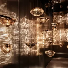 This installation shows the magic that happens when light and glass dance together. I curated this collection of hand-blown glass pendants to create a gallery of light, where each piece casts unique, rippling patterns on the walls, turning a simple space into an immersive experience.