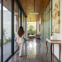 The Green Axis is a commercial workspace I designed to feel contemplative and calm. The core of the project is this linear corridor, which runs alongside a verdant courtyard, using natural light and framed views to connect the employees to nature throughout the day.