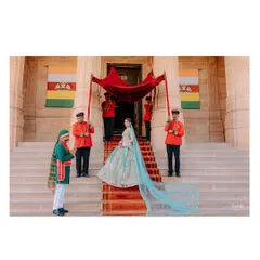 A fairytale bridal entry at Umaid Bhawan Palace. The bride's grand entrance, complete with a flowing veil and royal attendants, is a moment of pure cinematic drama.