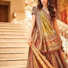 A full view of this gorgeous Tarun Tahiliani lehenga, showcasing the rich, earthy tones and detailed embroidery. It’s a perfect outfit for a garba night or any festive wedding event.
