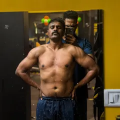 A closer look at the results of hard work. You can see the development of a more powerful and defined upper body, a direct result of our focused strength training and diet plan.