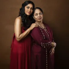 The bond between a mother and daughter is a precious legacy. This elegant portrait captures the love and connection shared between two generations of strong women.