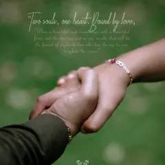A close-up of the couple holding hands, a simple yet powerful symbol of their connection and shared journey.