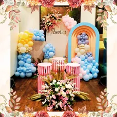 This dreamy birthday setup featured a beautiful blend of peach and pink tones. The decor included multiple arched backdrops, floral arrangements, and soft pastel balloon clusters, creating an elegant and whimsical atmosphere.