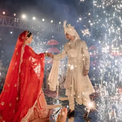 The moment of union, illuminated by a cascade of fireworks. I capture this climactic point of the wedding ceremony, where the couple's commitment is celebrated with a spectacle of light, creating a truly unforgettable, dream-like image.