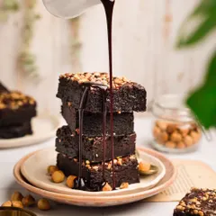 Capturing the perfect action shot is a thrill. For this hazelnut brownie, I wanted to show its rich, gooey texture. The pouring chocolate sauce creates a dynamic and irresistible image that makes you want to grab a spoon.