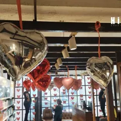 This view from an upper level shows the density of the Valentine's Day heart balloons. I arranged them at different heights to create a dynamic, floating effect that looks great from every angle.