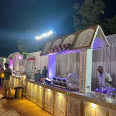A closer look at the details of my traditional white and gold themed buffet station. Every setup includes professional chafing dishes to keep the food warm and fresh, and my uniformed staff is always on hand to ensure your guests are well taken care of.