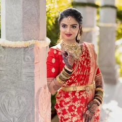 A stunning South Indian bride in her muhurtham look. The intricate mehendi design on her hands and arms adds another layer of tradition and beauty to her bridal ensemble.
