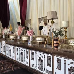 Our custom-designed buffet counters feature intricate patterns, like this haveli-inspired facade, that integrate seamlessly with your wedding decor. We believe the food station should be a centerpiece of the event.