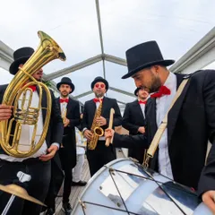 A lively brass band in top hats and bow ties adds a touch of quirky fun to a boat party. We believe in surprising guests with unique and memorable entertainment choices.