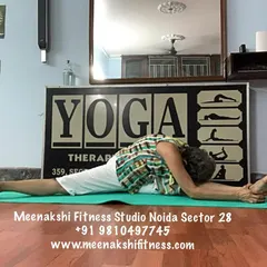 A deep forward fold within the center split. This variation intensifies the stretch in the inner thighs and hamstrings, a posture we work towards step by step.