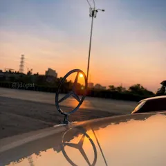 I focus on the small details that define a car's character. This is a sunset shot of a classic Mercedes-Benz hood ornament, with the sun perfectly aligned to create a starburst effect.