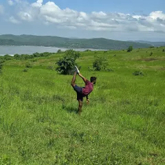 Practicing Natarajasana (Dancer's Pose) in a field in Gokarna. For me, setting a stage for practice is like worshipping the body, finding beauty in the movement and the surroundings.