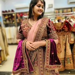 A closer look at the rich maroon velvet and exquisite gold embroidery of this royal bridal lehenga. The craftsmanship is designed to make you feel graceful and breathtaking.