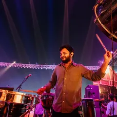 Playing the timbales and a large bass drum during a live concert with Asees Kaur in Jajpur. This setup is perfect for creating powerful, driving rhythms for large outdoor events.