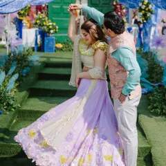 A candid moment of the couple dancing. The makeup is designed to look fresh and beautiful even in bright daylight, and it's completely sweat-proof.