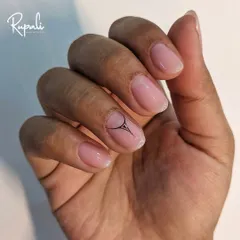 A minimalist design with a single, graphic black accent on a sheer pink base. It's subtle, modern, and chic.