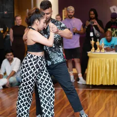 Another shot from the Olympiad of Kizomba qualifier held at our 'Bailar Conmigo 2.0' festival. You can see the judges and audience in the background, highlighting the competitive environment we prepare our students for.