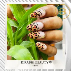 Get wild with this classic leopard print nail art. I use different shades of brown and black to create a realistic and stylish animal print design.