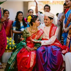 A quiet glance between the bride and groom amidst the wedding rituals. These are the unscripted moments that tell the real story of the day.