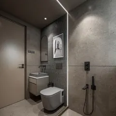 For a bold, masculine look, I used large-format grey concrete-finish tiles throughout this bathroom. The vertical LED strip light dramatically separates the wet and dry areas while adding a futuristic touch. All fixtures are in a modern matte black finish.