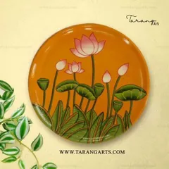 The timeless elegance of Pichwai art is captured in this hand-painted wooden plate featuring serene lotus flowers. Each stroke tells a story of tradition and beauty.