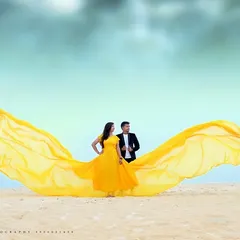 A spectacular beach shot with our yellow flying gown. The way the fabric catches the wind creates a beautiful, wing-like effect that looks amazing in photos.