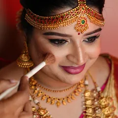 The gentle application of blush to give the bride a natural, healthy flush. This getting-ready shot shows the care I take in every step of the process.