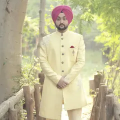 This groom looks dapper in our light yellow embroidered sherwani, a perfect choice for a daytime wedding. The subtle detailing and fit make it a popular rental choice.