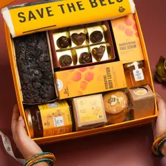 This shot uses hand modeling to make the gift hamper feel more personal and aspirational. It helps customers imagine themselves receiving or gifting the beautiful box.