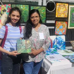 My collection of tiny paintings spread out at Chitra Santhe, attracting art admirers of all ages. These small canvases are a great way to start your art collection.